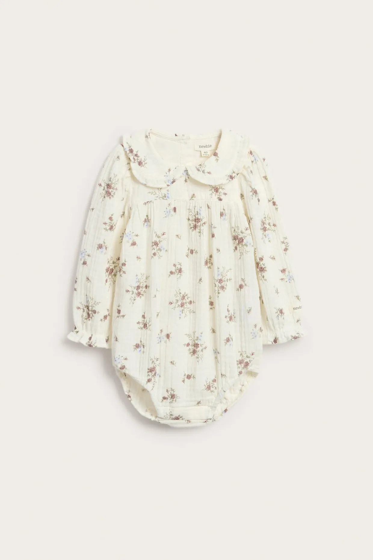Blomstret blusebody med volanger