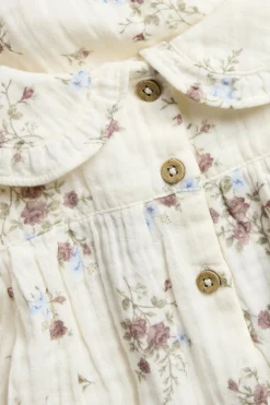 Blomstret blusebody med volanger