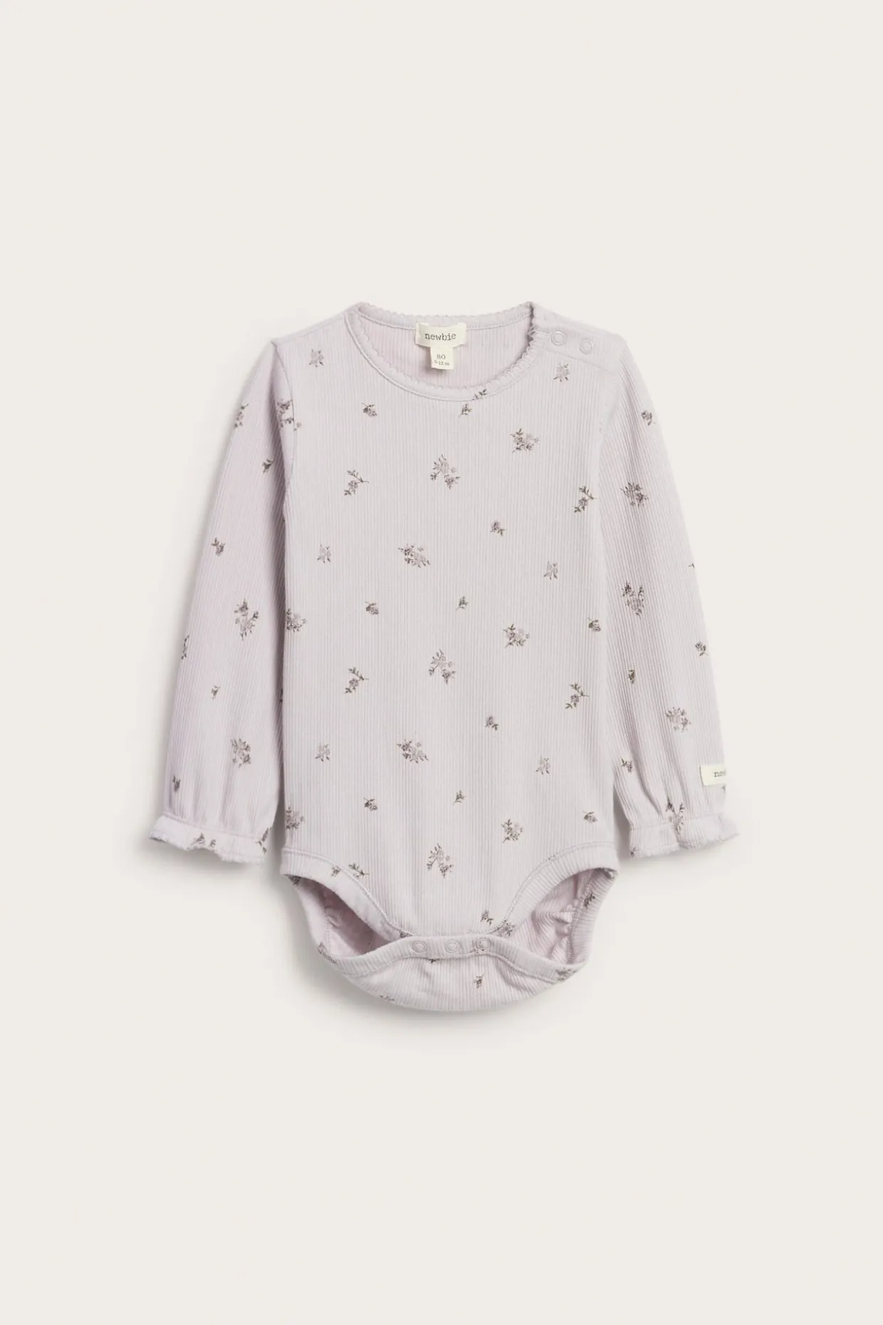 Blomstrete body i ribbetrikot