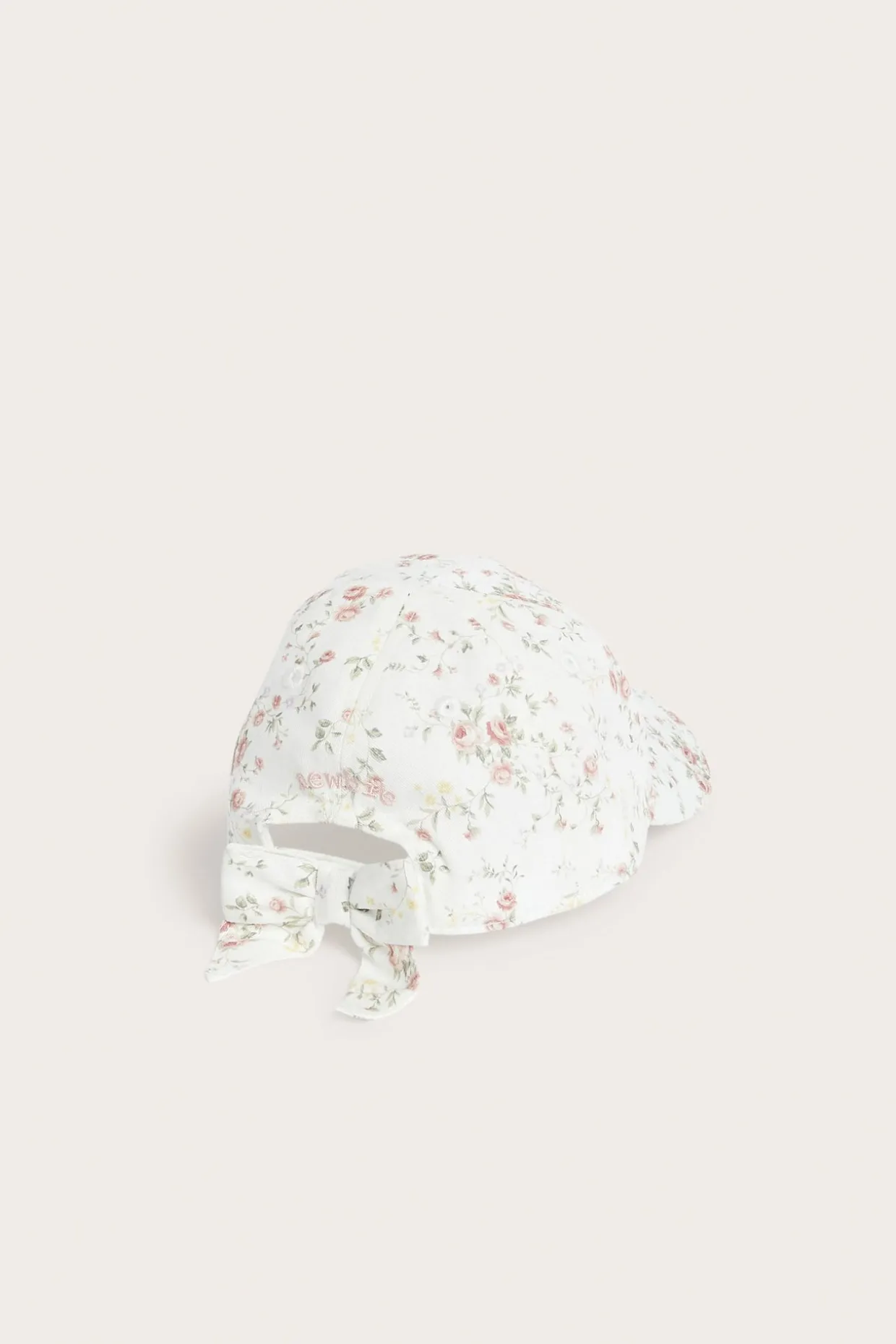 Blomstrete caps med sløyfe