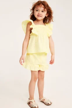 Bluse med volanger og broderi