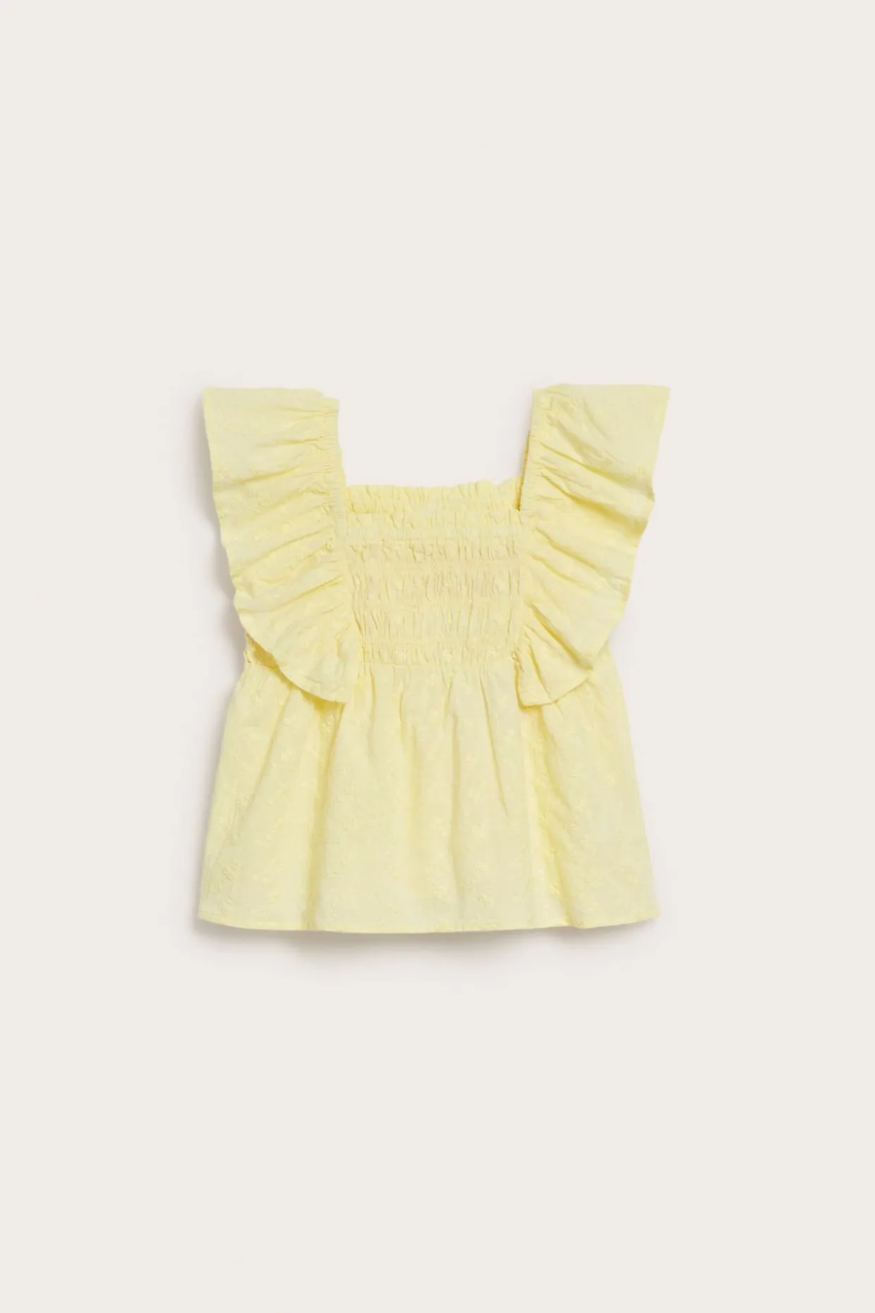 Bluse med volanger og broderi