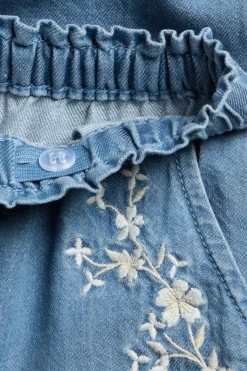 Denimbukse med blomsterbroderier