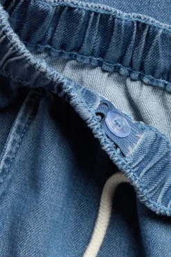 Denimbukser med snøring