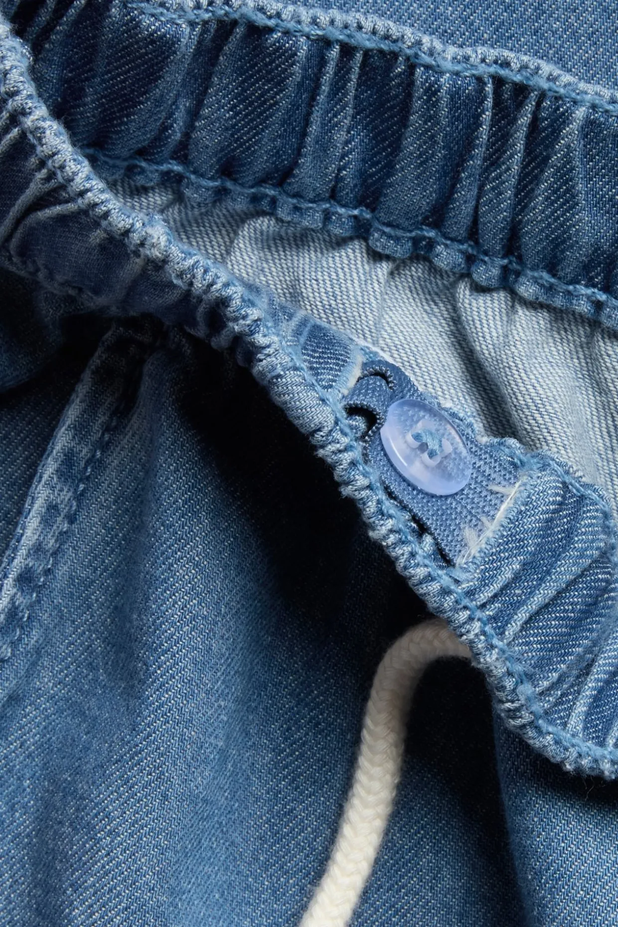 Denimbukser med snøring