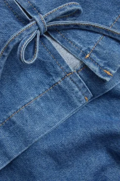 Ermeløs denimtopp med knytebånd i siden