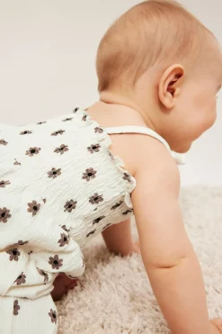 Jumpsuit med små blomster og sløyfer