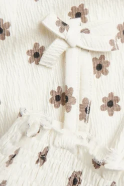 Jumpsuit med små blomster og sløyfer