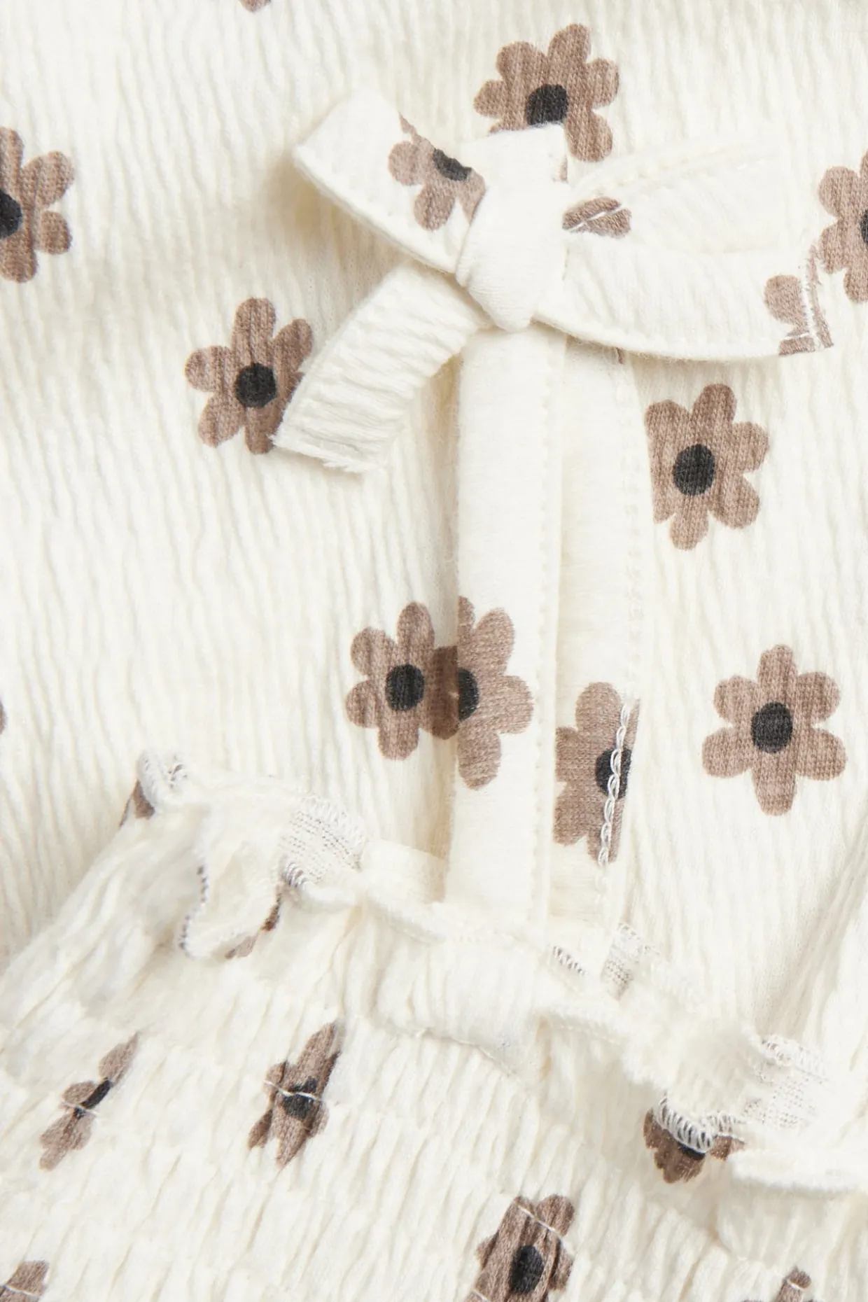 Jumpsuit med små blomster og sløyfer