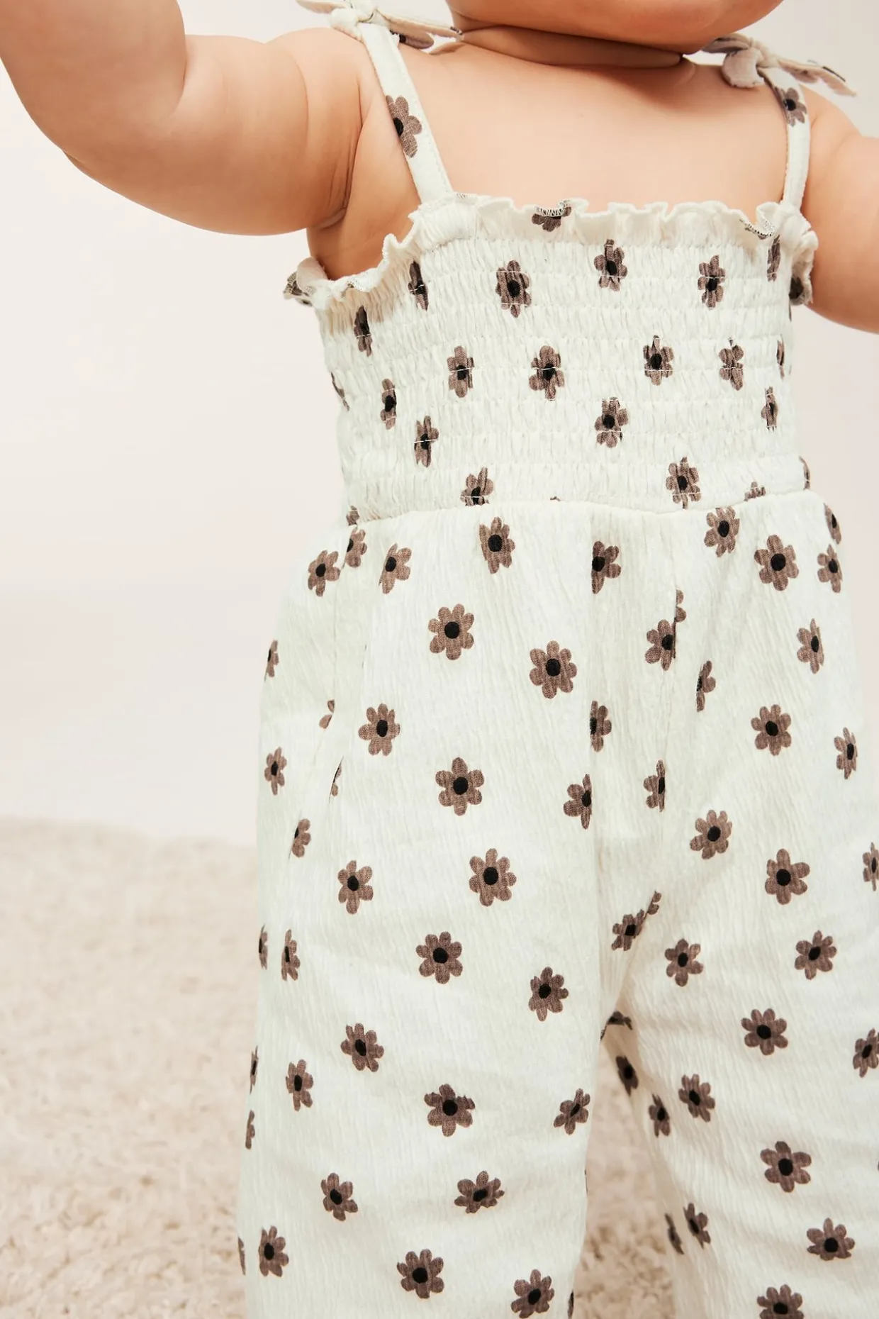 Jumpsuit med små blomster og sløyfer