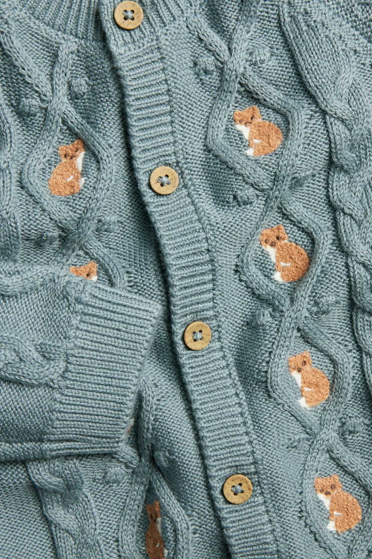 Kabelstrikket cardigan med revemotiv