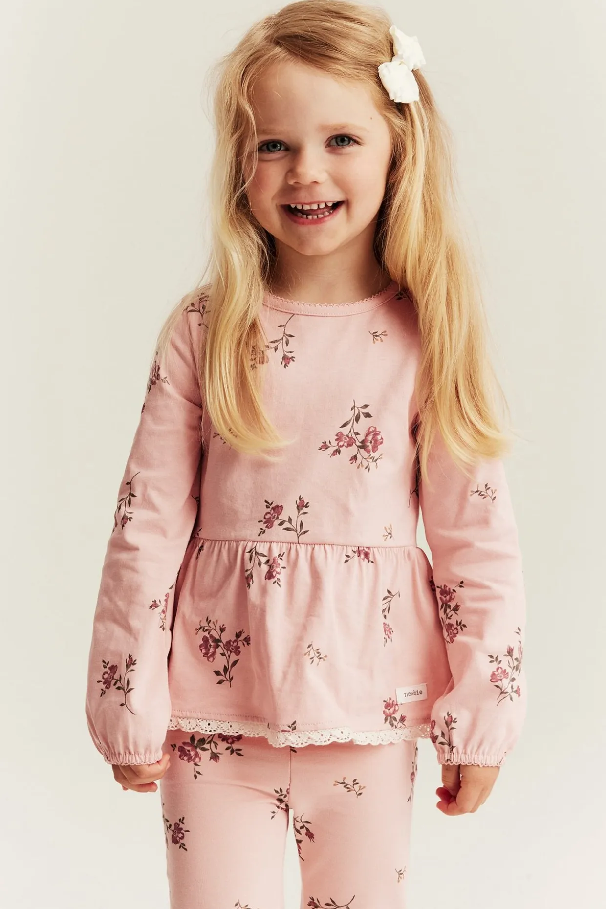 Langermet blomstret peplum-topp