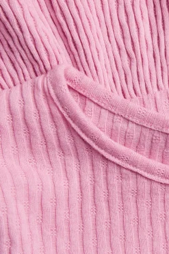 Langermet peplumtopp i ribbet trikot