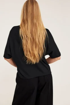 Oversized topp med korte ermer
