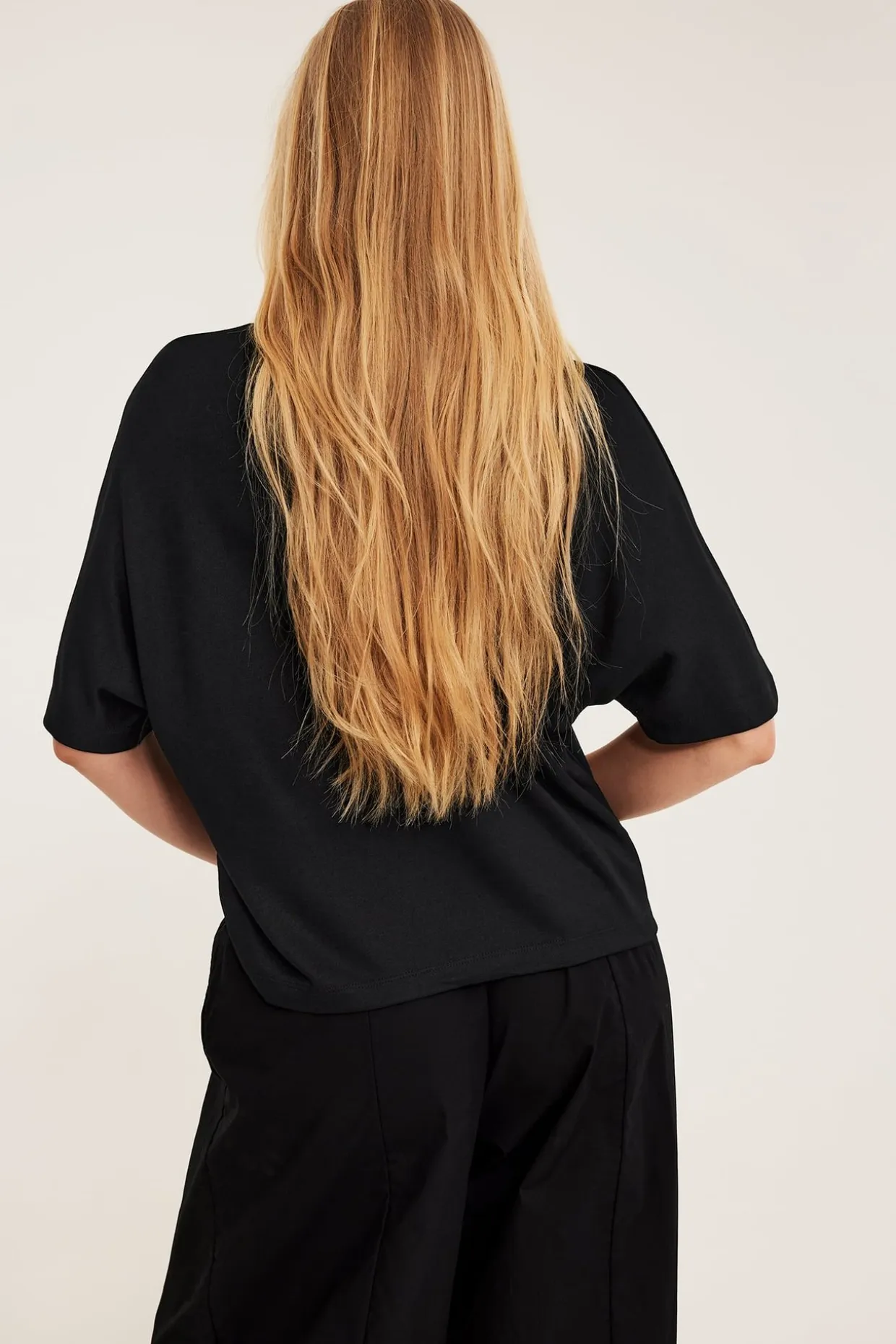 Oversized topp med korte ermer