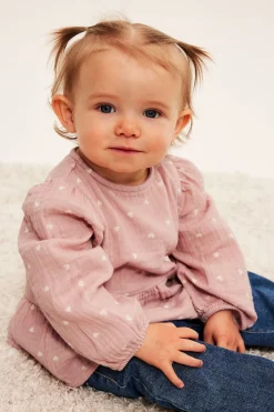 Peplumbluse for baby i myk musselin