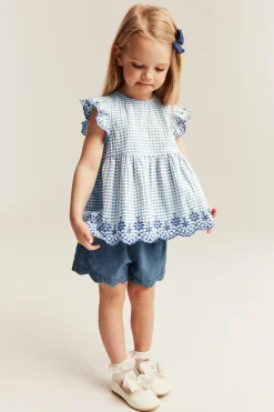 Peplum-bluse med broderi