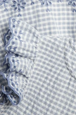 Peplum-bluse med broderi