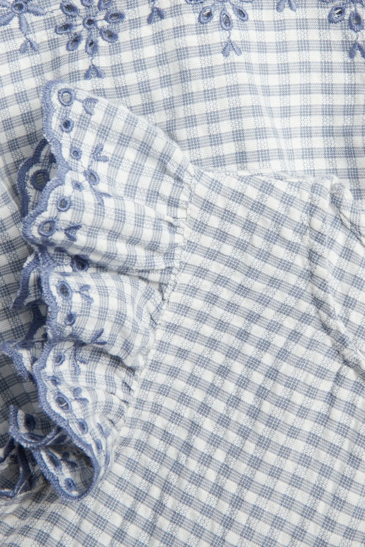 Peplum-bluse med broderi