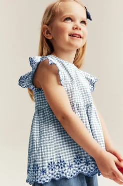 Peplum-bluse med broderi