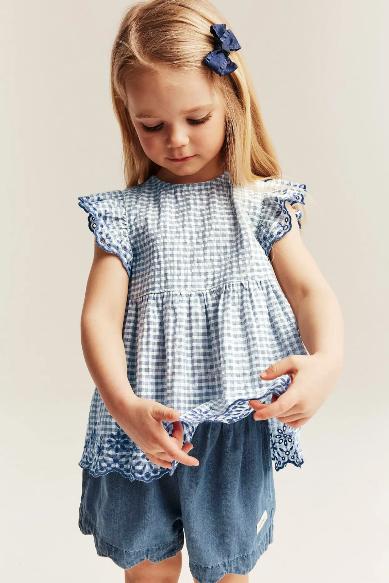Peplum-bluse med broderi