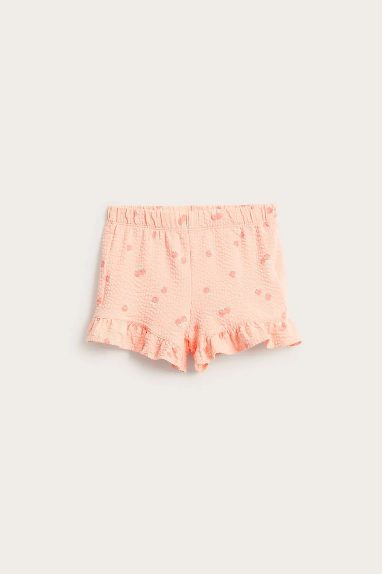 Shorts med ferskenmønster og volangkant