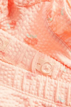 Shorts med ferskenmønster og volangkant