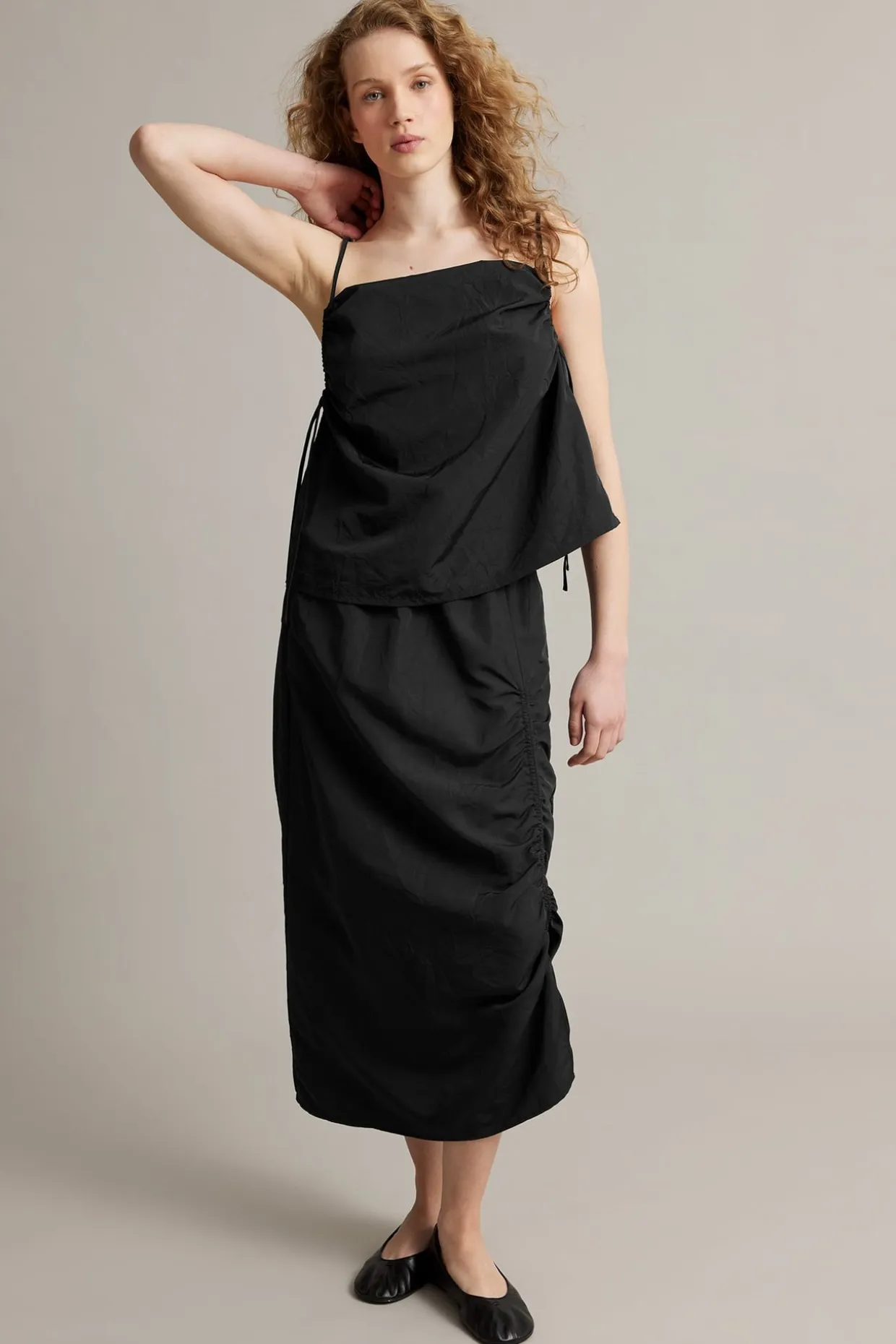 Singlet med draperingsdetaljer