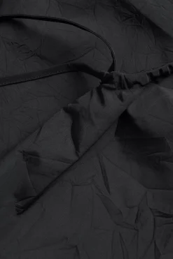 Singlet med draperingsdetaljer