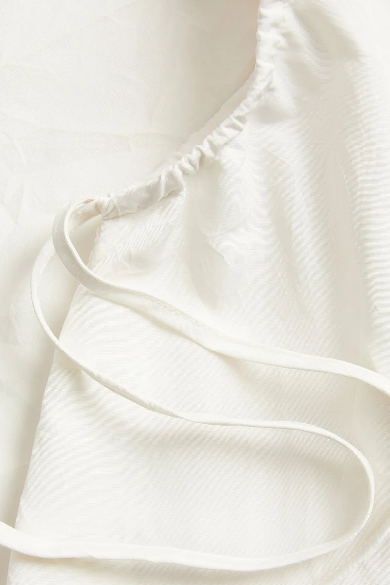 Singlet med draperingsdetaljer