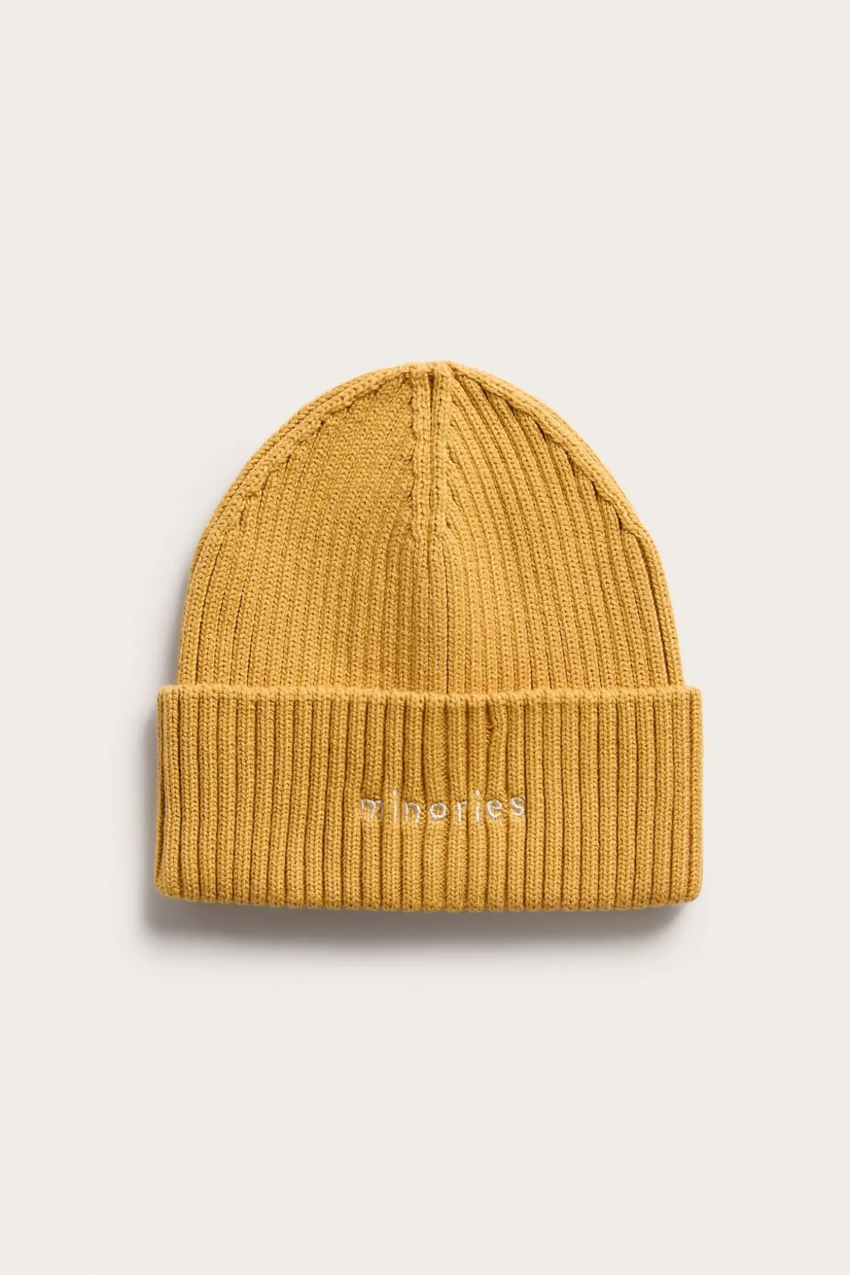 Strikkelue med broderi