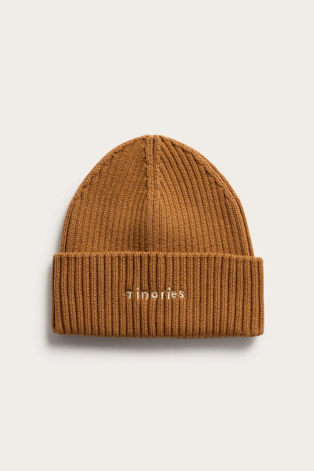 Strikkelue med broderi
