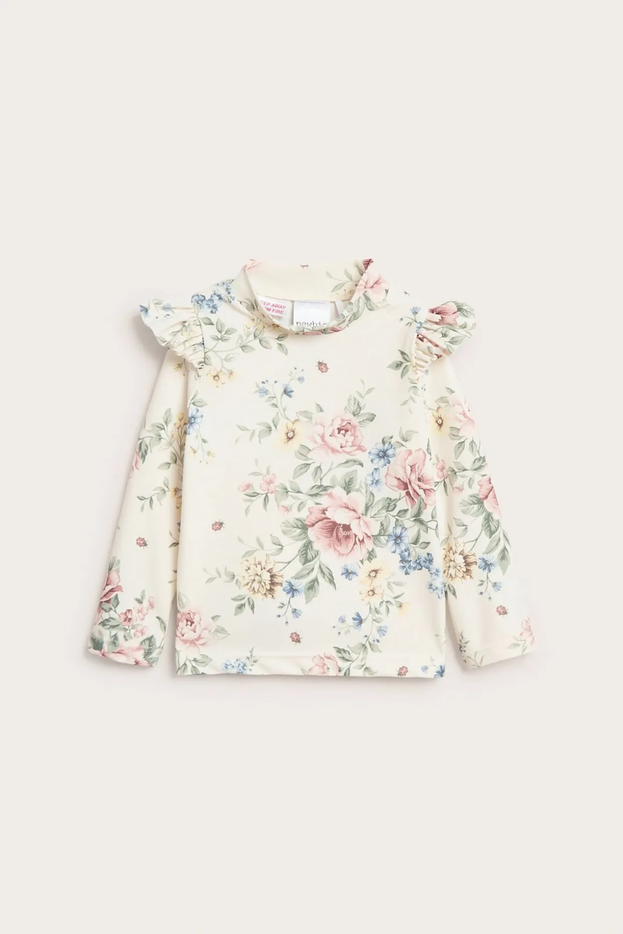 UV-topp med blomster og volanger