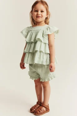 Vevd bluse med volanger