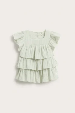 Vevd bluse med volanger