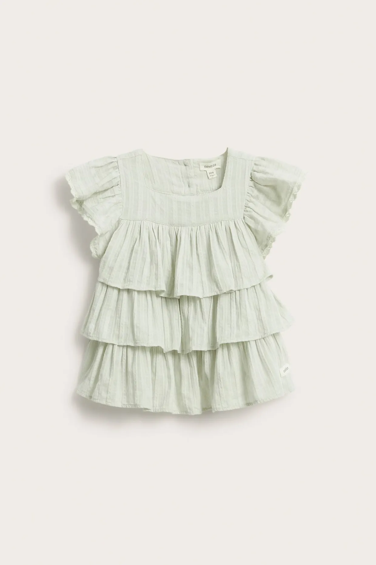Vevd bluse med volanger