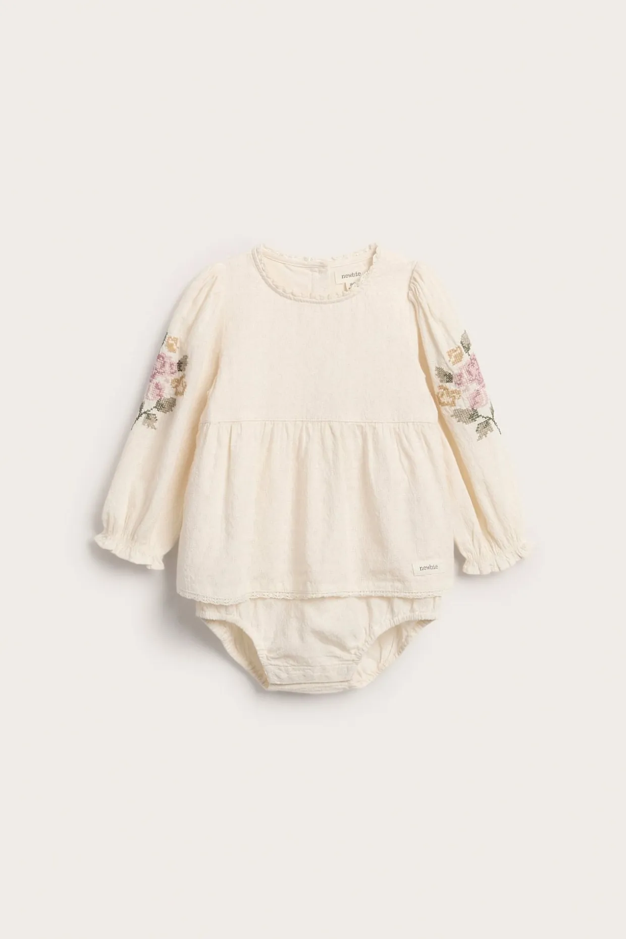 Vevd body med blomsterbroderi